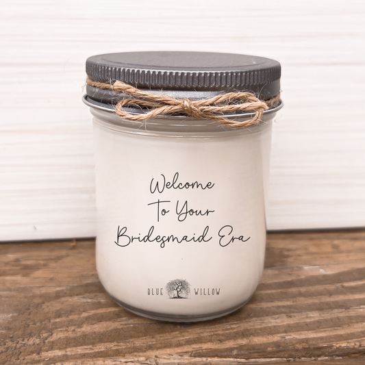 a mason jar with the words welcome to your bridesmaid