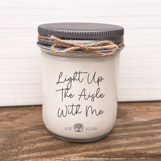 a mason jar with a quote on it sitting on a wooden table