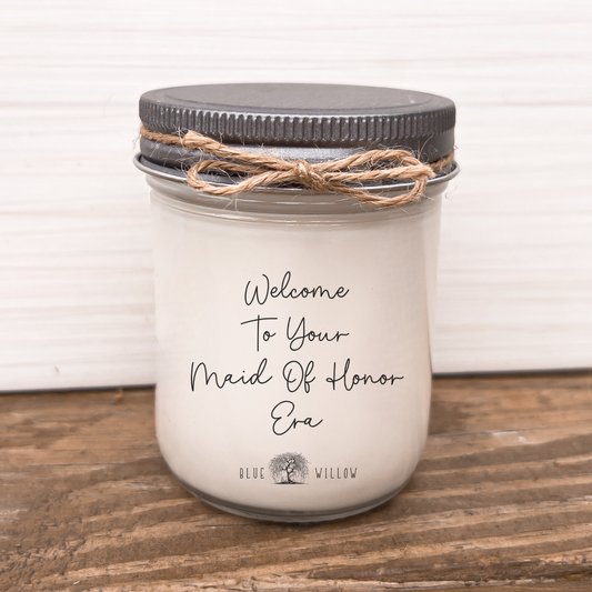 a mason jar with a welcome message on it